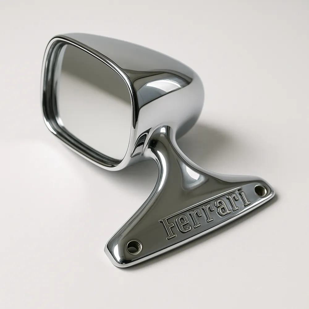Chrome-plated Ferrari side mirror on white surface