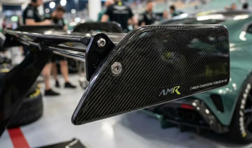 Close-up detail of carbon fiber on a performance car part