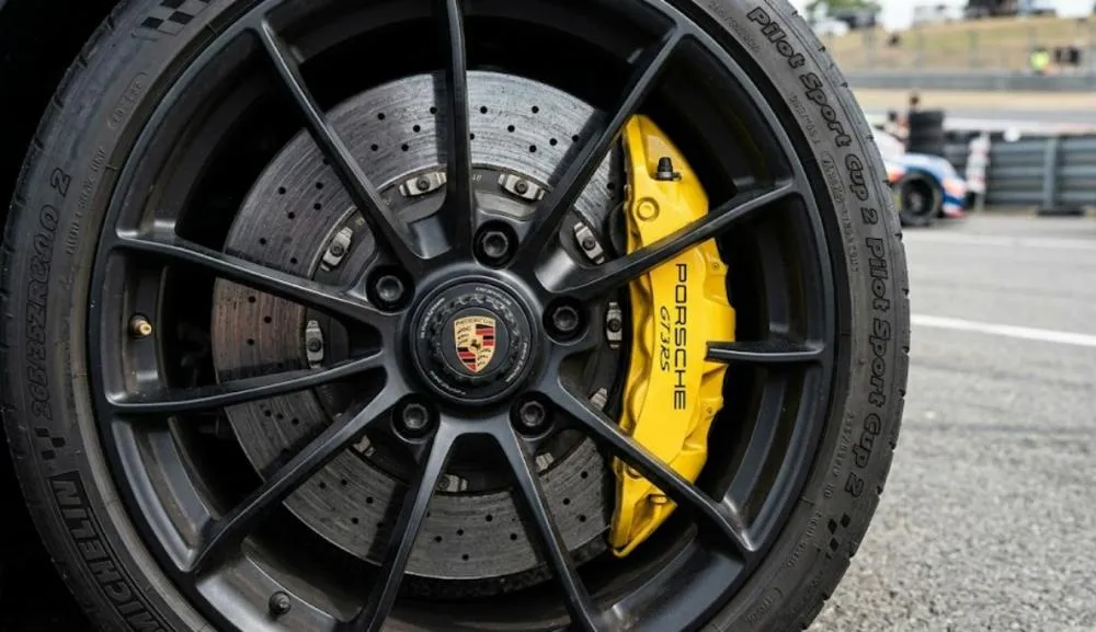 Close view of a performance car wheel and brake assembly