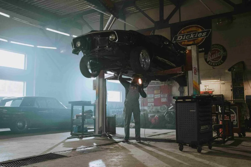 Luxury car on workshop lift