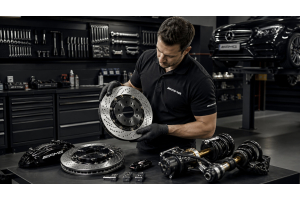 Mechanic inspecting premium car parts in a workshop