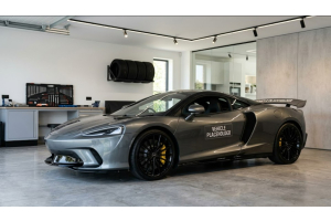 Placeholder image of a luxury sports car parked inside a clean garage